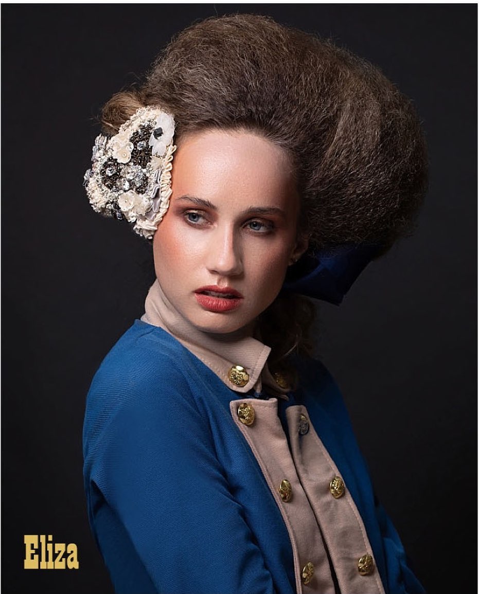 Beauty editorial portrait with sculpted hair and floral headpiece