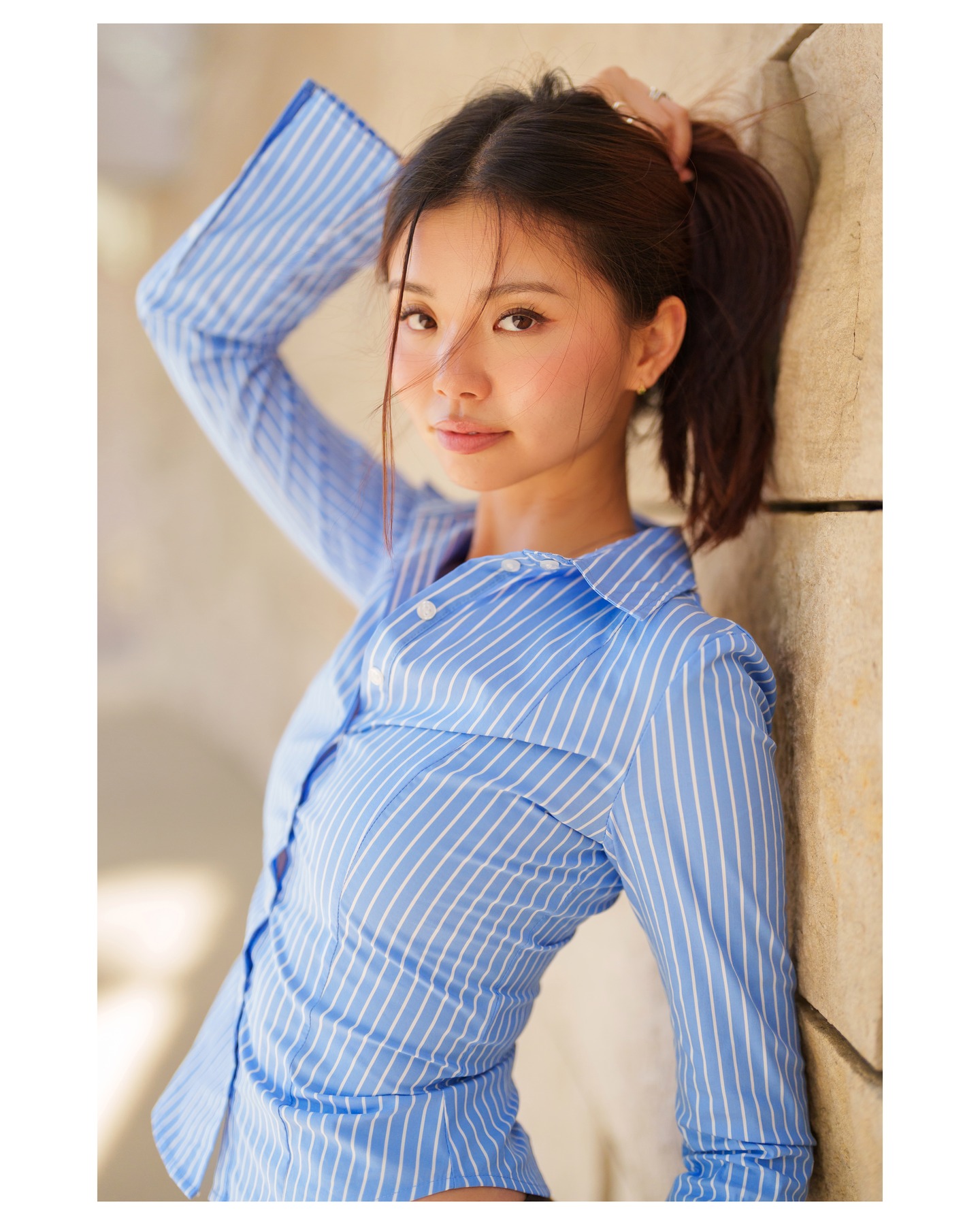 Blue-striped fashion portrait in natural light