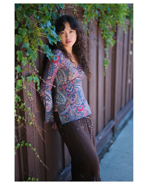 Colorful paisley fashion portrait in a garden setting